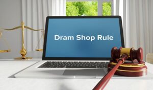 Dram Shop Rule – law, jurisdiction. A lawyer laptop in the off