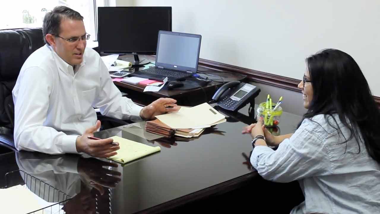 Attorney Brett Boulton Working with Client