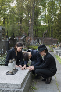 mourning-family-together-cemetery
