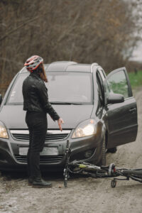 Road accident with cyclist man driver and car